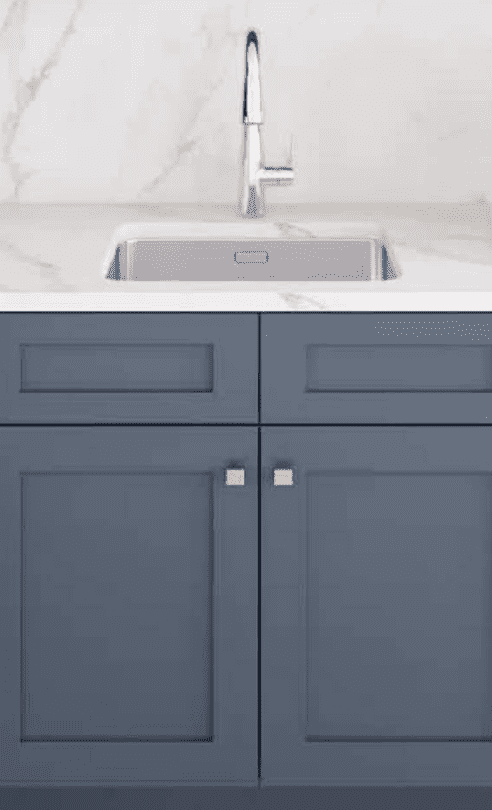 A stylish kitchen featuring Vita Cabinetry's Emerald Series Blue Cabinets from CabinetEZ in Clinton, MD.